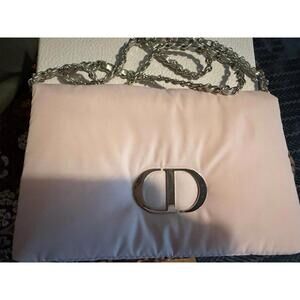 Dior beauty pink pillow pouch.